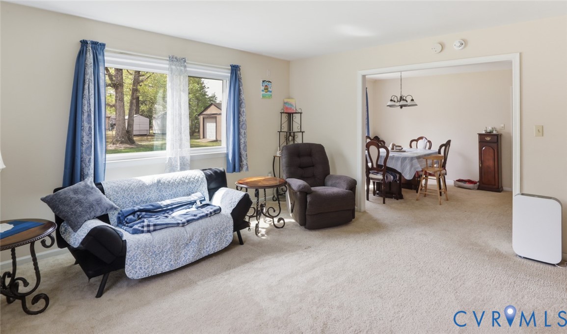 598 Old Wagner Road Petersburg, VA 23805 - Photo 22 of 43 Carpeted living area featuring a large picture win