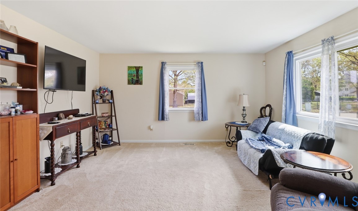 598 Old Wagner Road Petersburg, VA 23805 - Photo 23 of 43 Bright living area with neutral carpeting and ligh