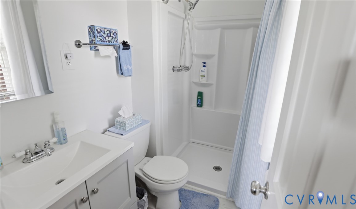 598 Old Wagner Road Petersburg, VA 23805 - Photo 28 of 43 Bathroom featuring a shower stall with built-in sh