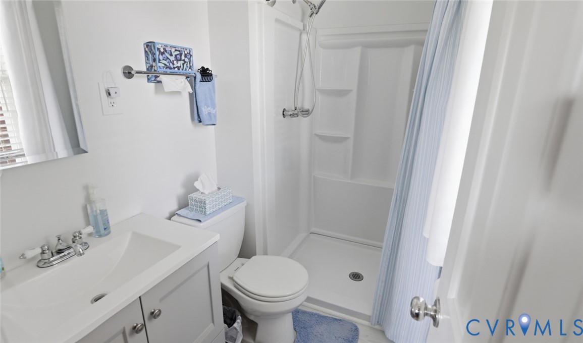 598 Old Wagner Road Petersburg, VA 23805 - Photo 30 of 43 Full bathroom featuring a single vanity with stora