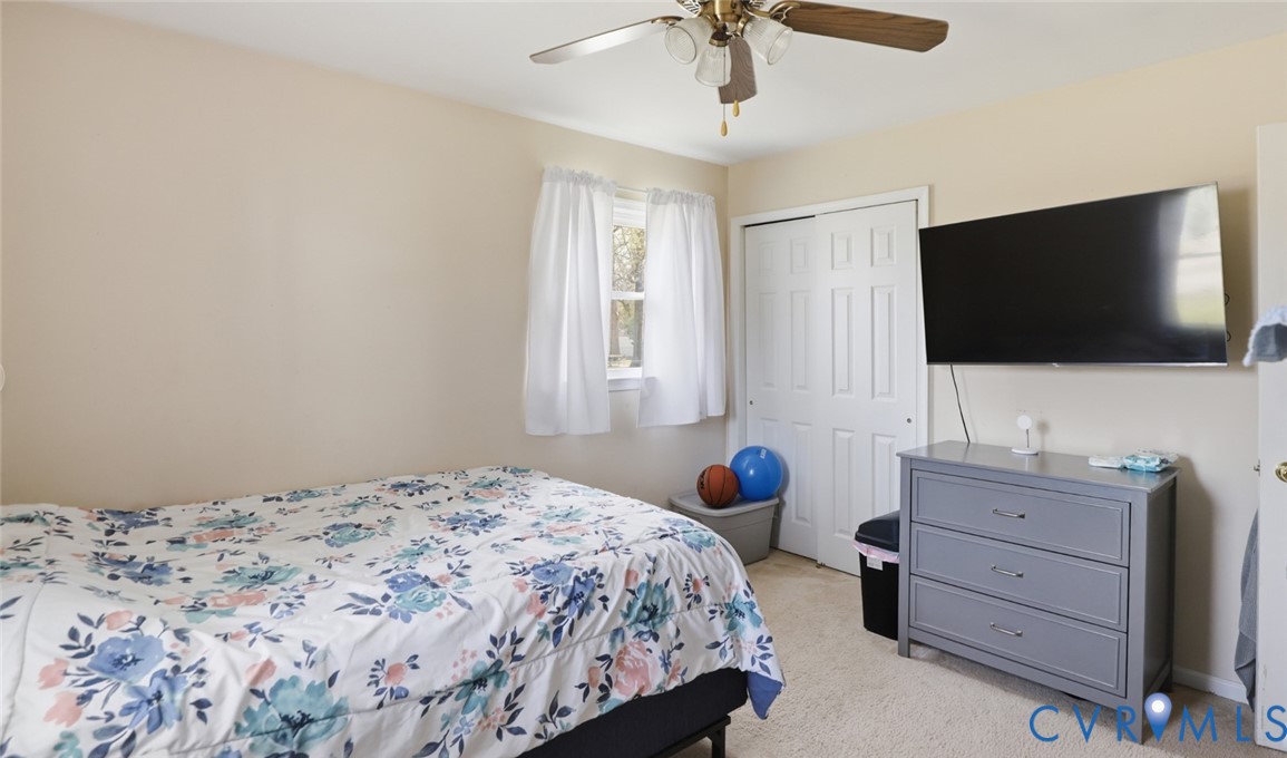 598 Old Wagner Road Petersburg, VA 23805 - Photo 33 of 43 Carpeted room featuring a ceiling fan with light f