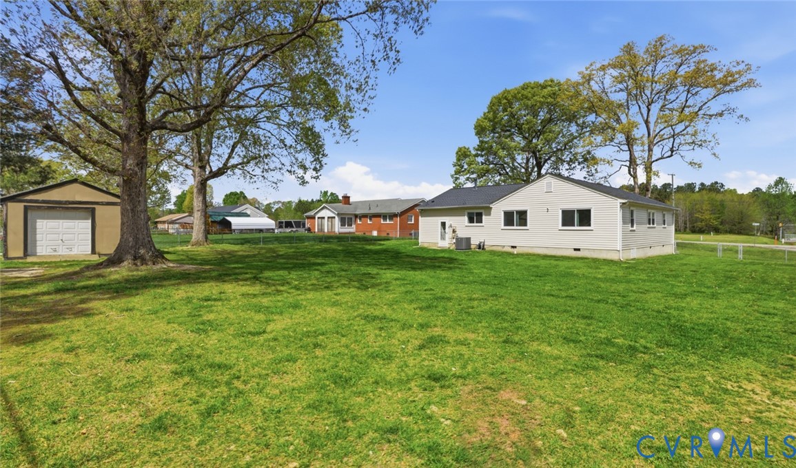 598 Old Wagner Road Petersburg, VA 23805 - Photo 39 of 43 Expansive green lawn with mature trees and a detac