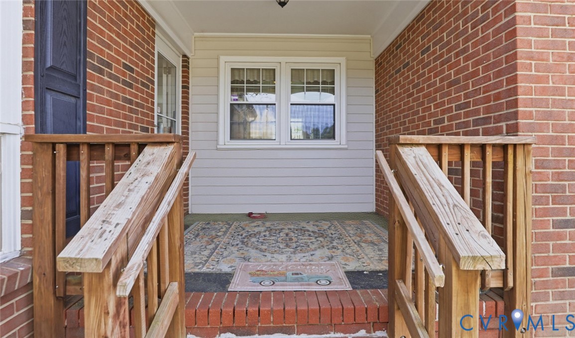 598 Old Wagner Road Petersburg, VA 23805 - Photo 4 of 43 Front porch with natural wood railings, brick colu