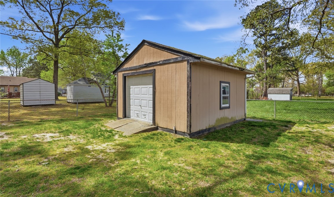 598 Old Wagner Road Petersburg, VA 23805 - Photo 43 of 43 Detached utility building with roll-up door and a