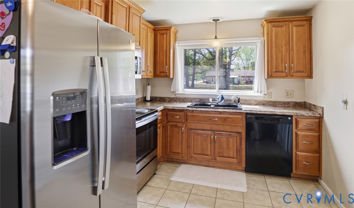 598 Old Wagner Road Petersburg, VA 23805 - Photo 5 of 43 Kitchen featuring wood cabinetry, light-toned coun