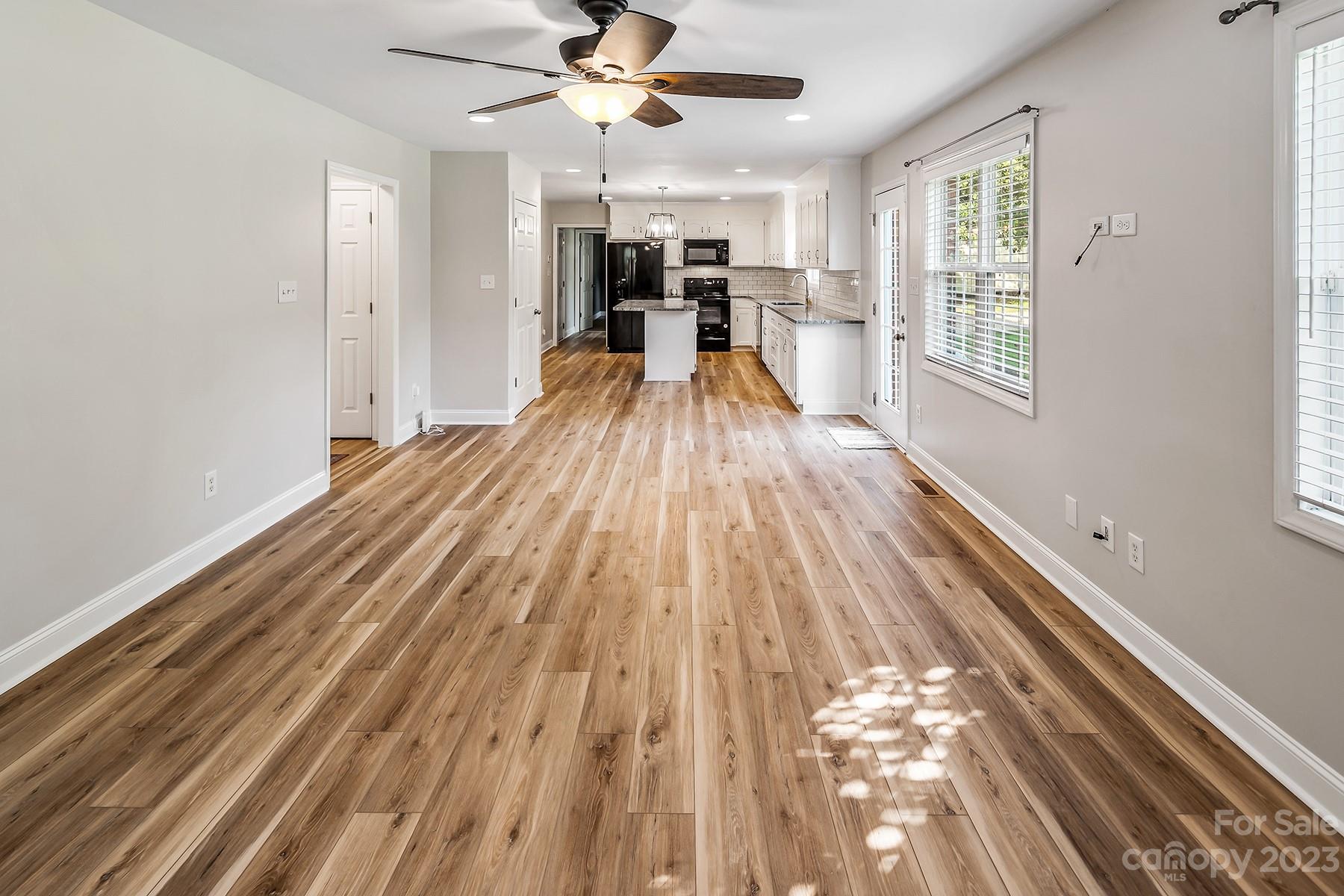 211 Todd Circle Wingate, NC 28174 - Photo 17 of 45 a view of a living room with wooden floor and window