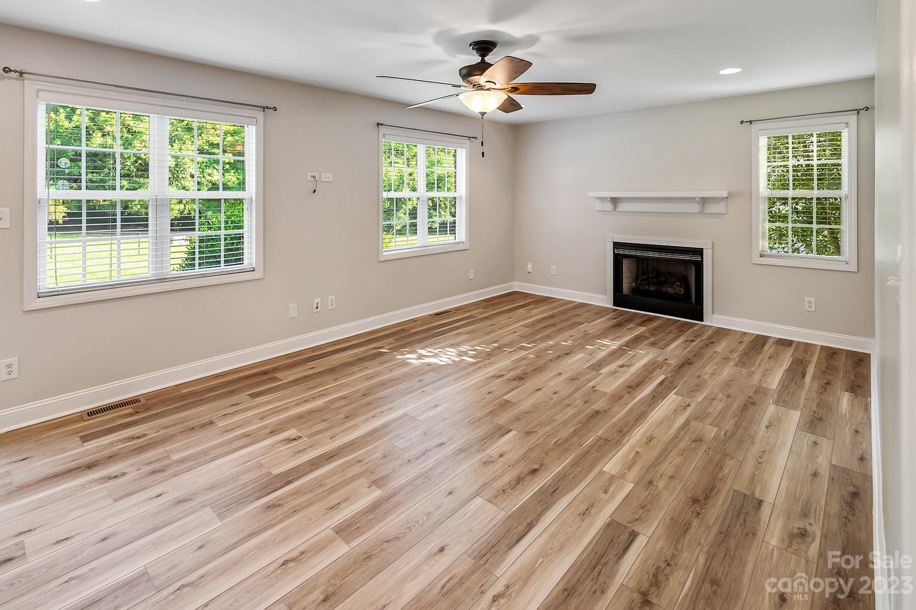 211 Todd Circle Wingate, NC 28174 - Photo 19 of 45 a view of an empty room with a window and fireplace