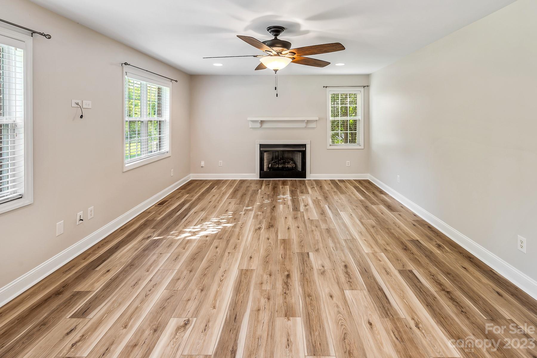211 Todd Circle Wingate, NC 28174 - Photo 20 of 45 a view of an empty room with a fireplace and a window