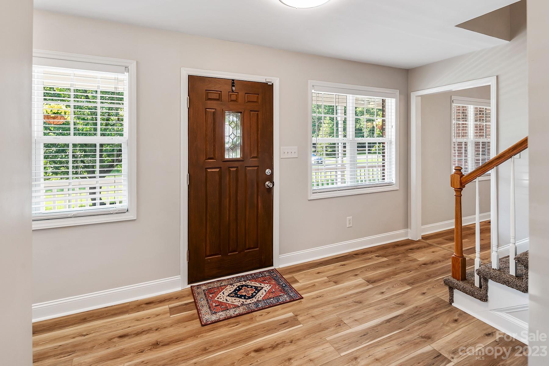 211 Todd Circle Wingate, NC 28174 - Photo 22 of 45 a view of an empty room with wooden floor and a window