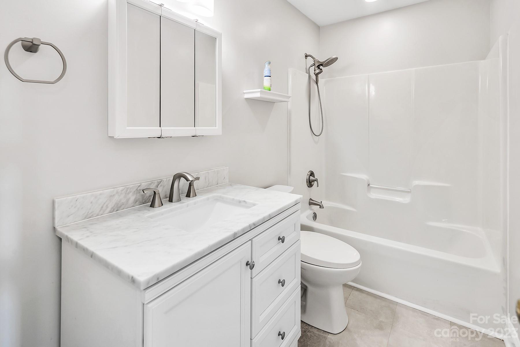 211 Todd Circle Wingate, NC 28174 - Photo 29 of 45 a bathroom with a sink a toilet and shower