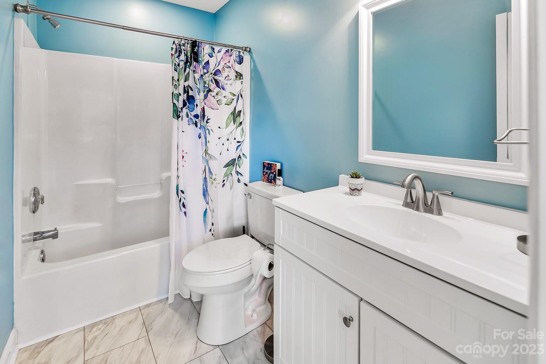 211 Todd Circle Wingate, NC 28174 - Photo 30 of 45 a bathroom with a sink toilet vanity and shower