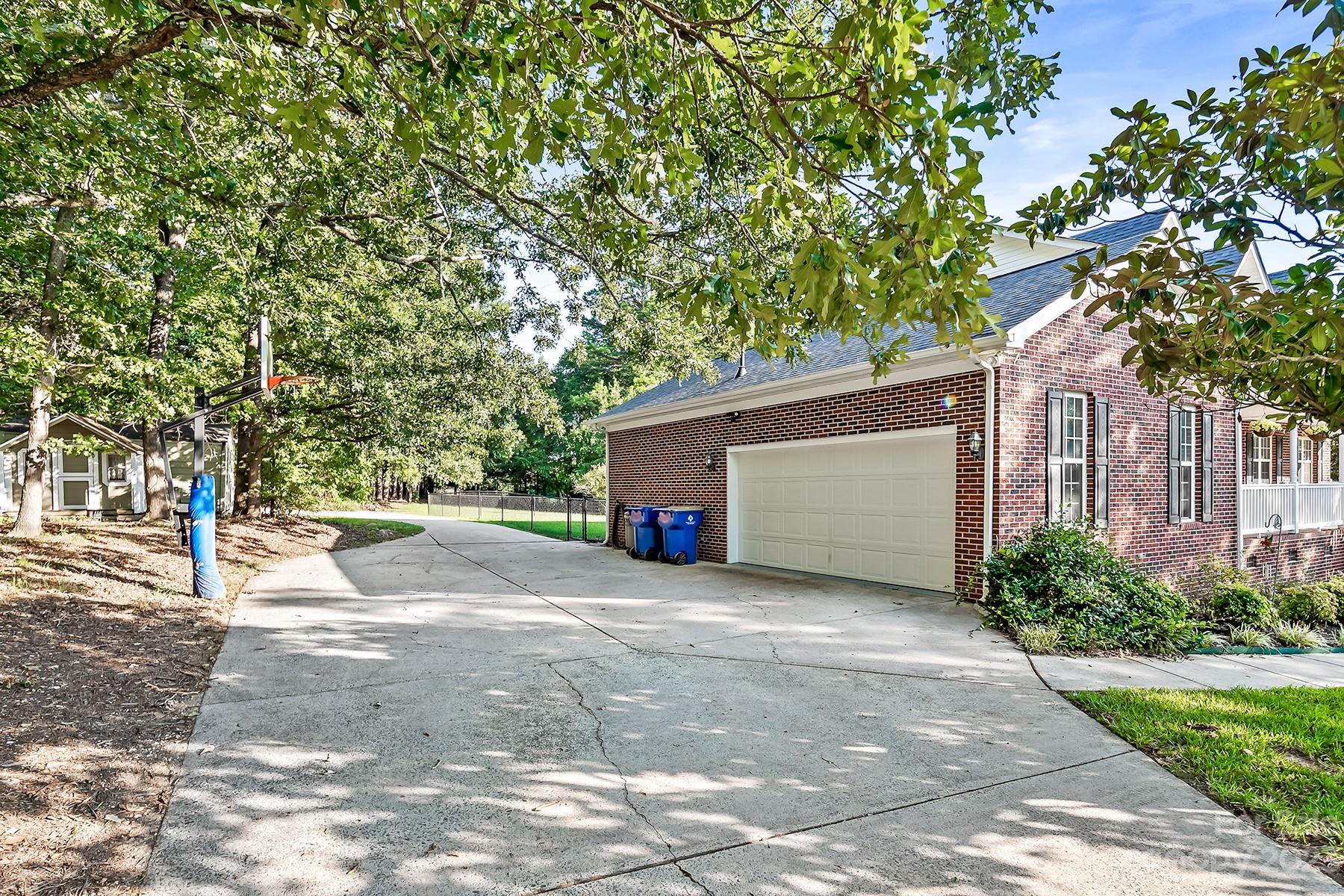 211 Todd Circle Wingate, NC 28174 - Photo 3 of 45 a view of a house with a tree and a yard