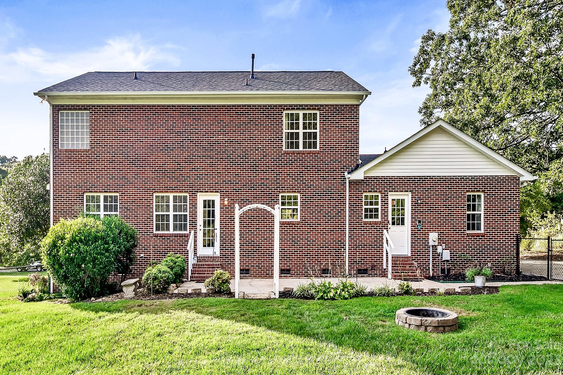 211 Todd Circle Wingate, NC 28174 - Photo 38 of 45 front view of a house with a yard