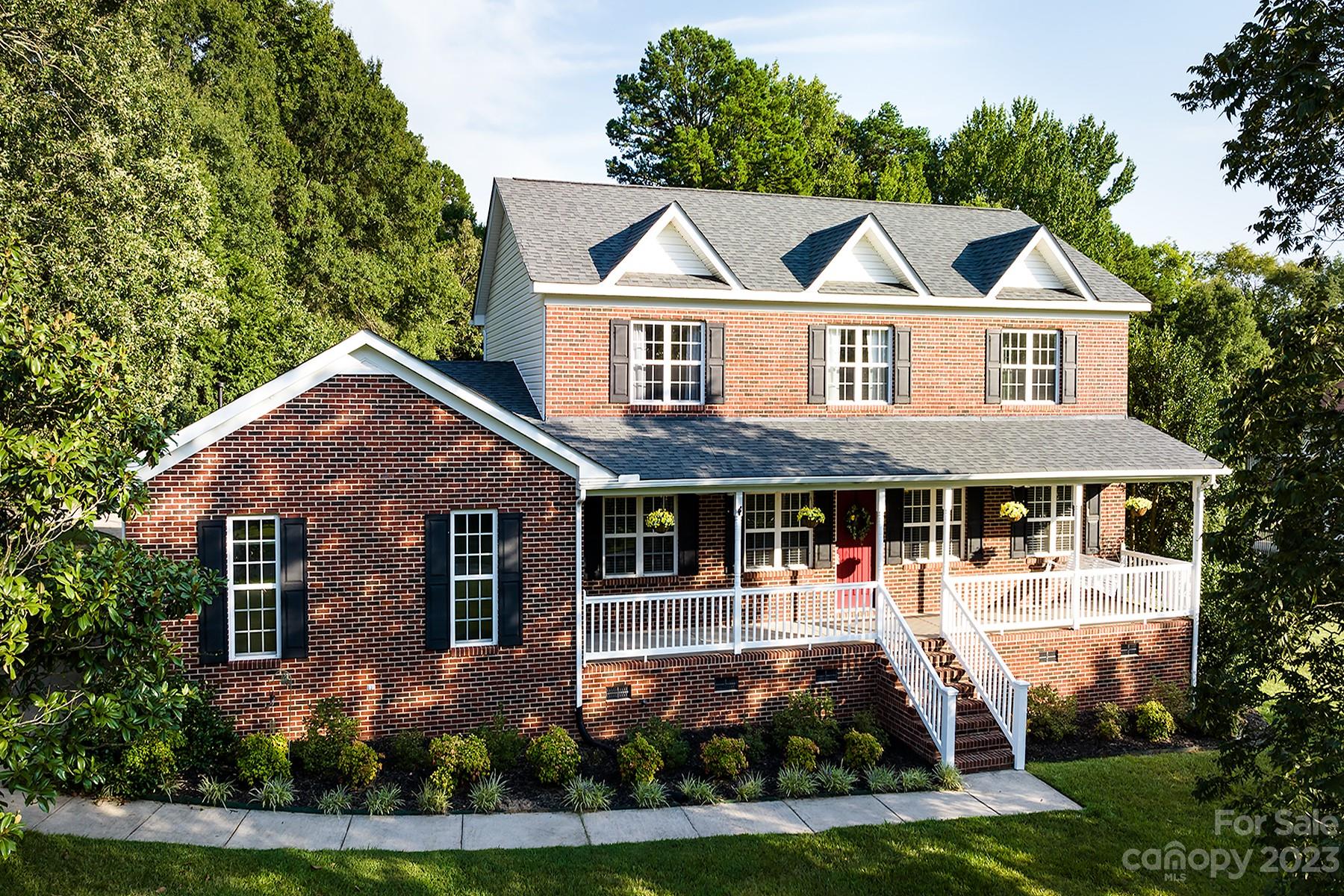 211 Todd Circle Wingate, NC 28174 - Photo 4 of 45 a front view of a house with a yard