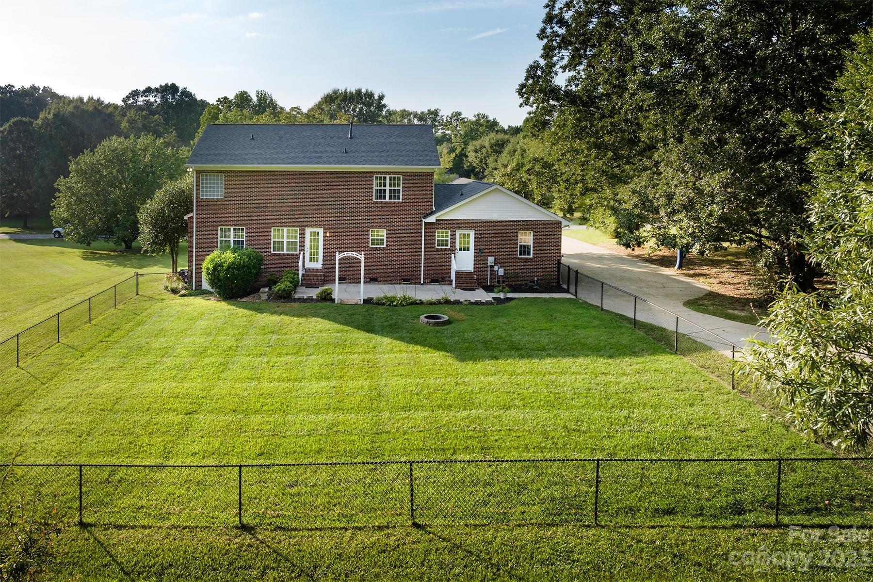 211 Todd Circle Wingate, NC 28174 - Photo 41 of 45 a view of a house with a yard and plants