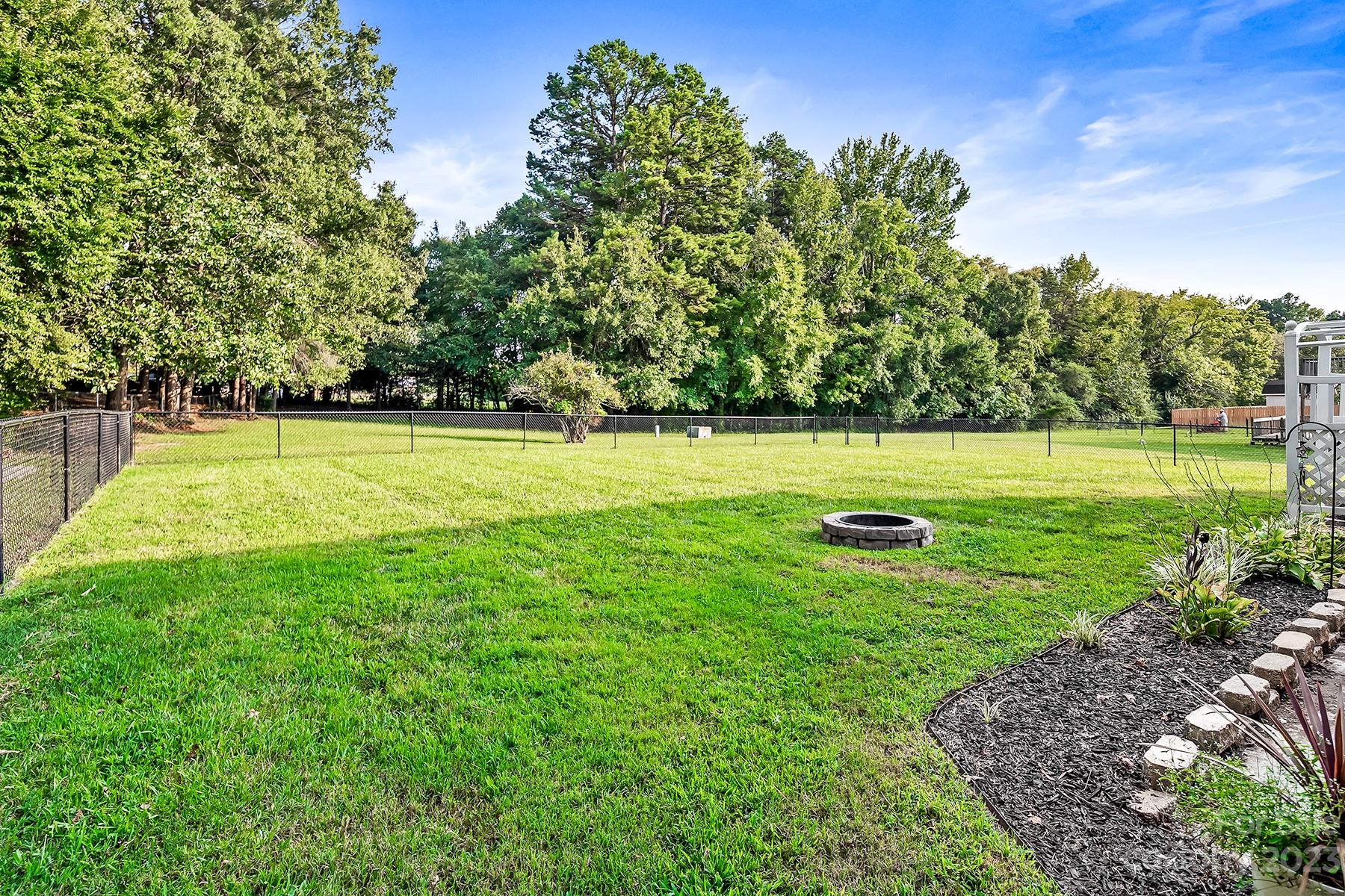 211 Todd Circle Wingate, NC 28174 - Photo 42 of 45 a view of a golf course with a lake