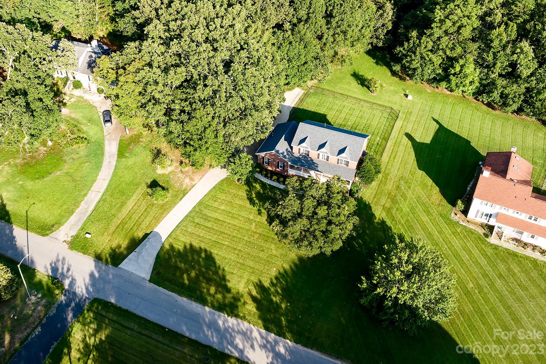 211 Todd Circle Wingate, NC 28174 - Photo 44 of 45 an aerial view of a house with a yard swimming pool and red chairs