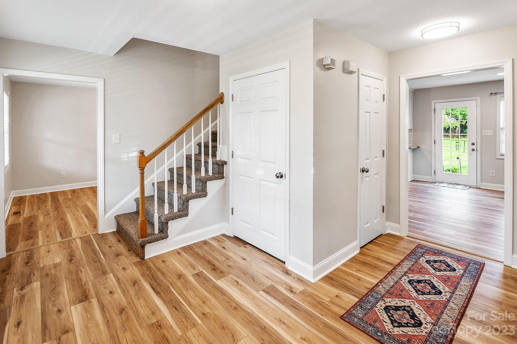 211 Todd Circle Wingate, NC 28174 - Photo 7 of 45 a view of a hallway with wooden floor and stairs