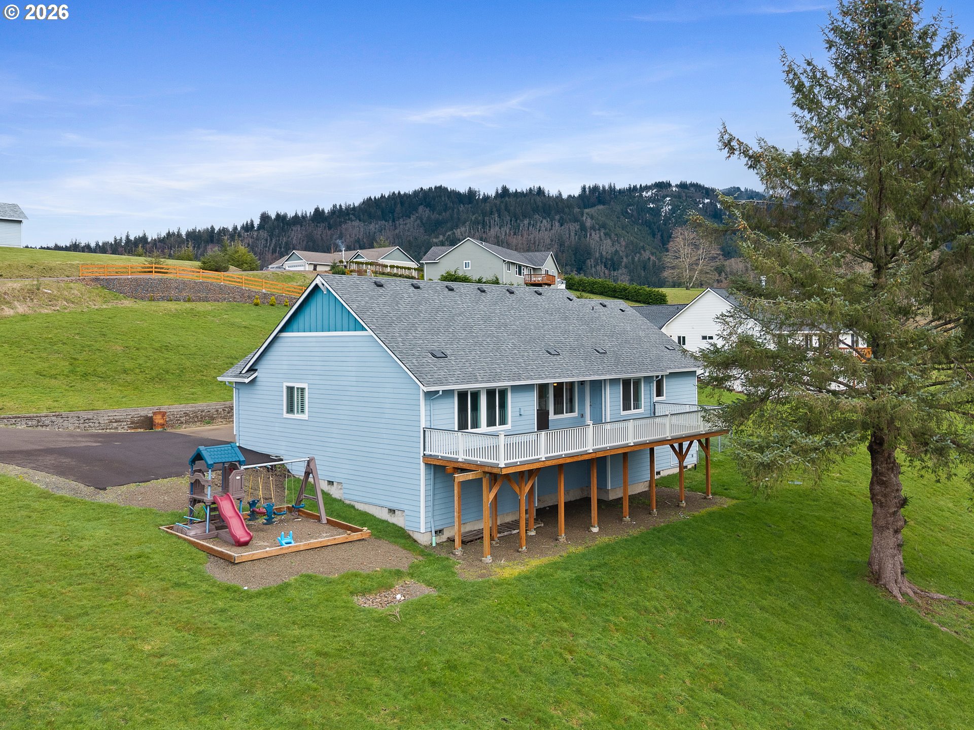 10360 Skyview Road Tillamook, OR 97141 - Photo 2 of 42 a view of a house with a garden