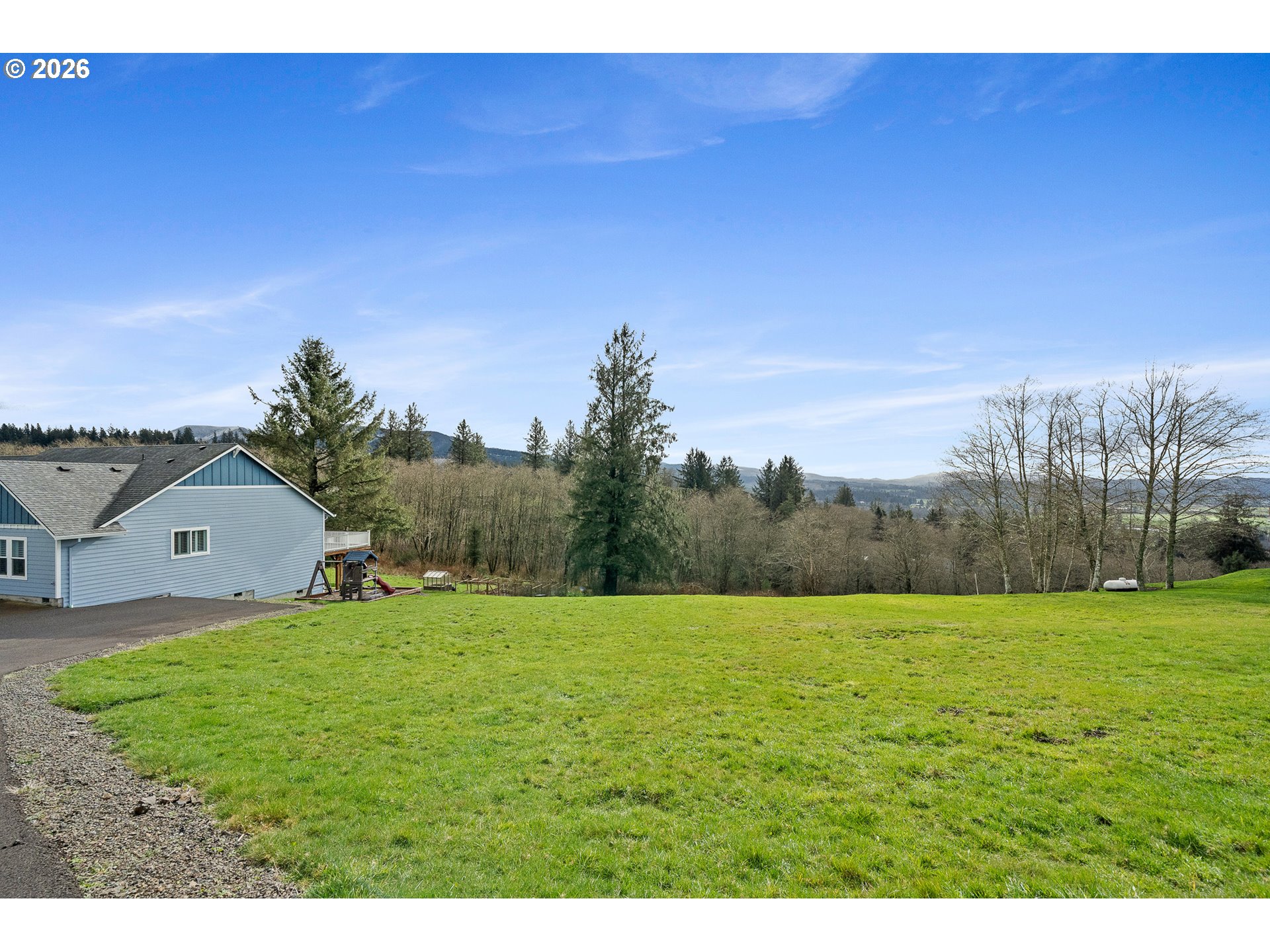 10360 Skyview Road Tillamook, OR 97141 - Photo 36 of 42 a view of a field with a tree in the background