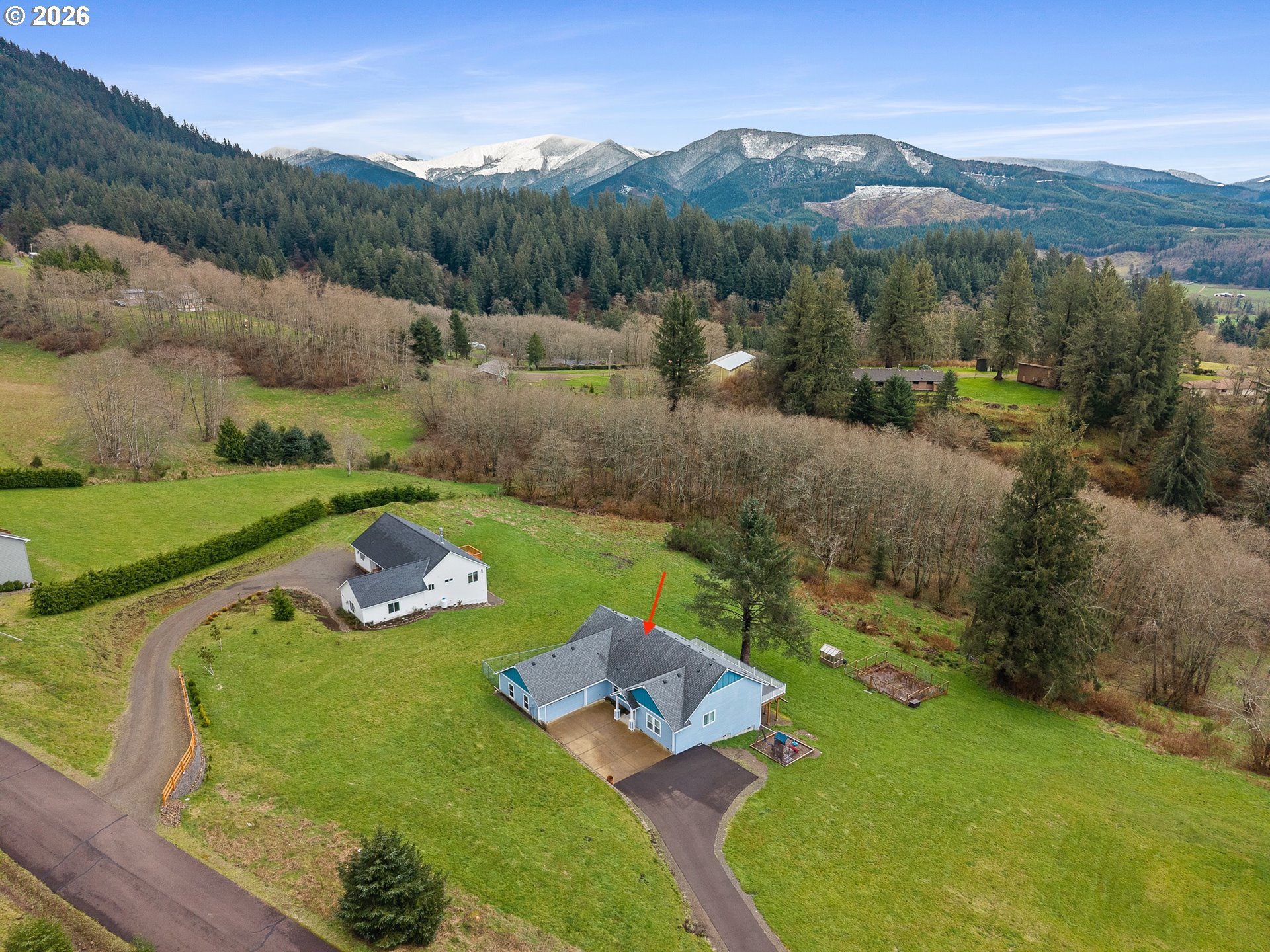 10360 Skyview Road Tillamook, OR 97141 - Photo 5 of 42 an aerial view of a house with a garden