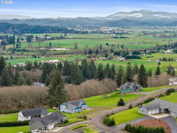 an aerial view of a golf course with parking space