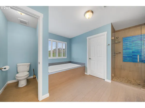 a bathroom with a toilet sink and a shower