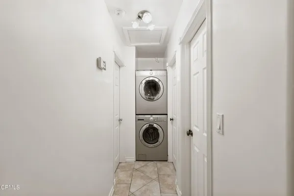 a close view of a utility room with dryer and washer