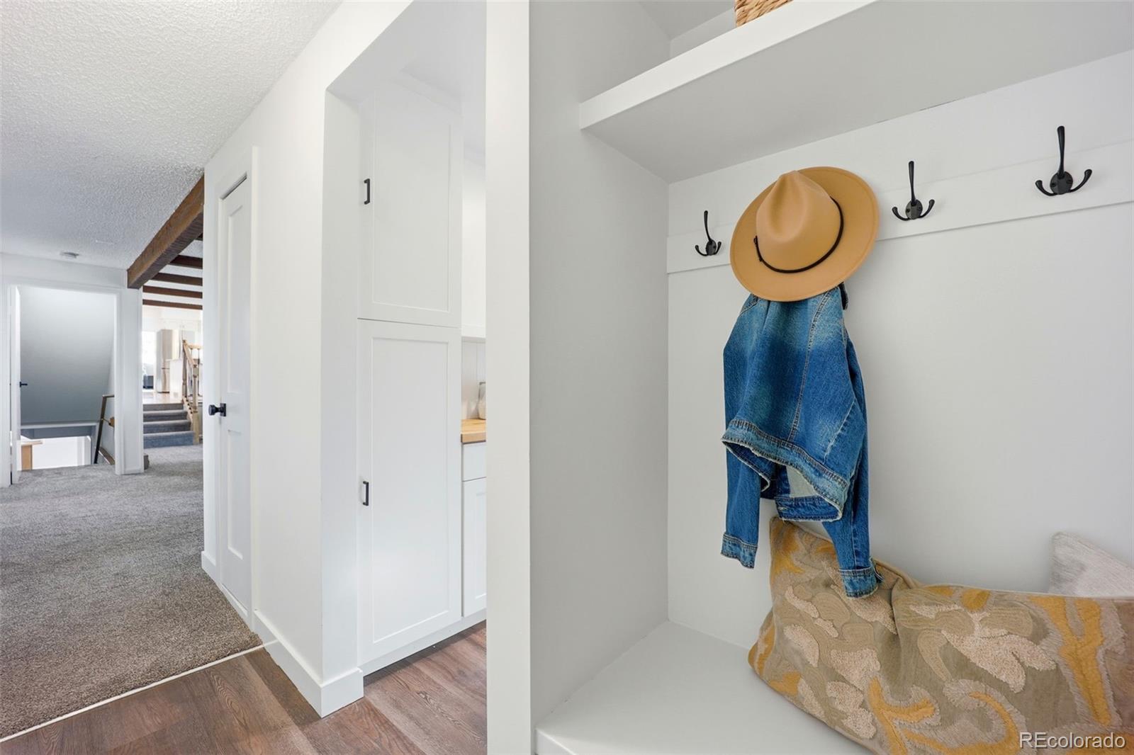9212 East Tanglewood Road Franktown, CO 80116 - Photo 28 of 50 a bedroom with a bed and cabinets