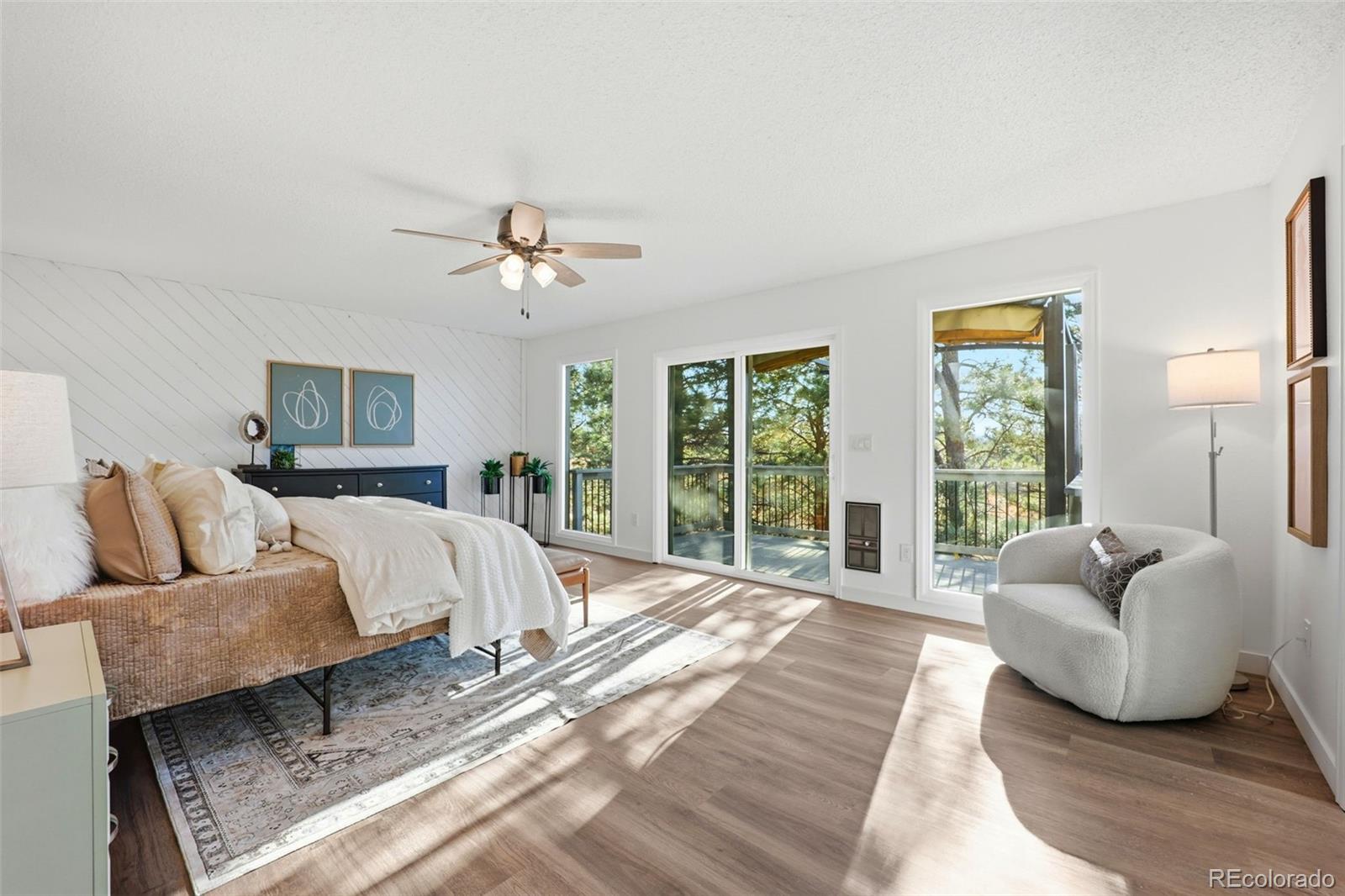 9212 East Tanglewood Road Franktown, CO 80116 - Photo 37 of 50 a living room with furniture and a large window