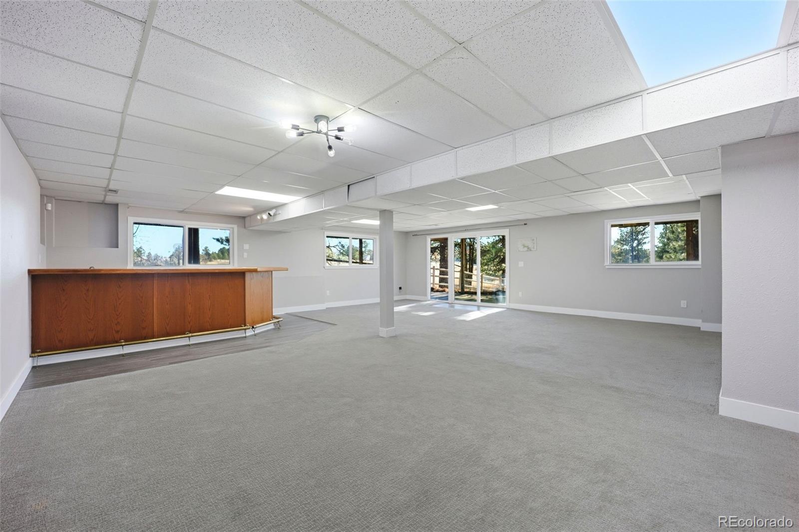 9212 East Tanglewood Road Franktown, CO 80116 - Photo 43 of 50 a view of a livingroom with a fireplace