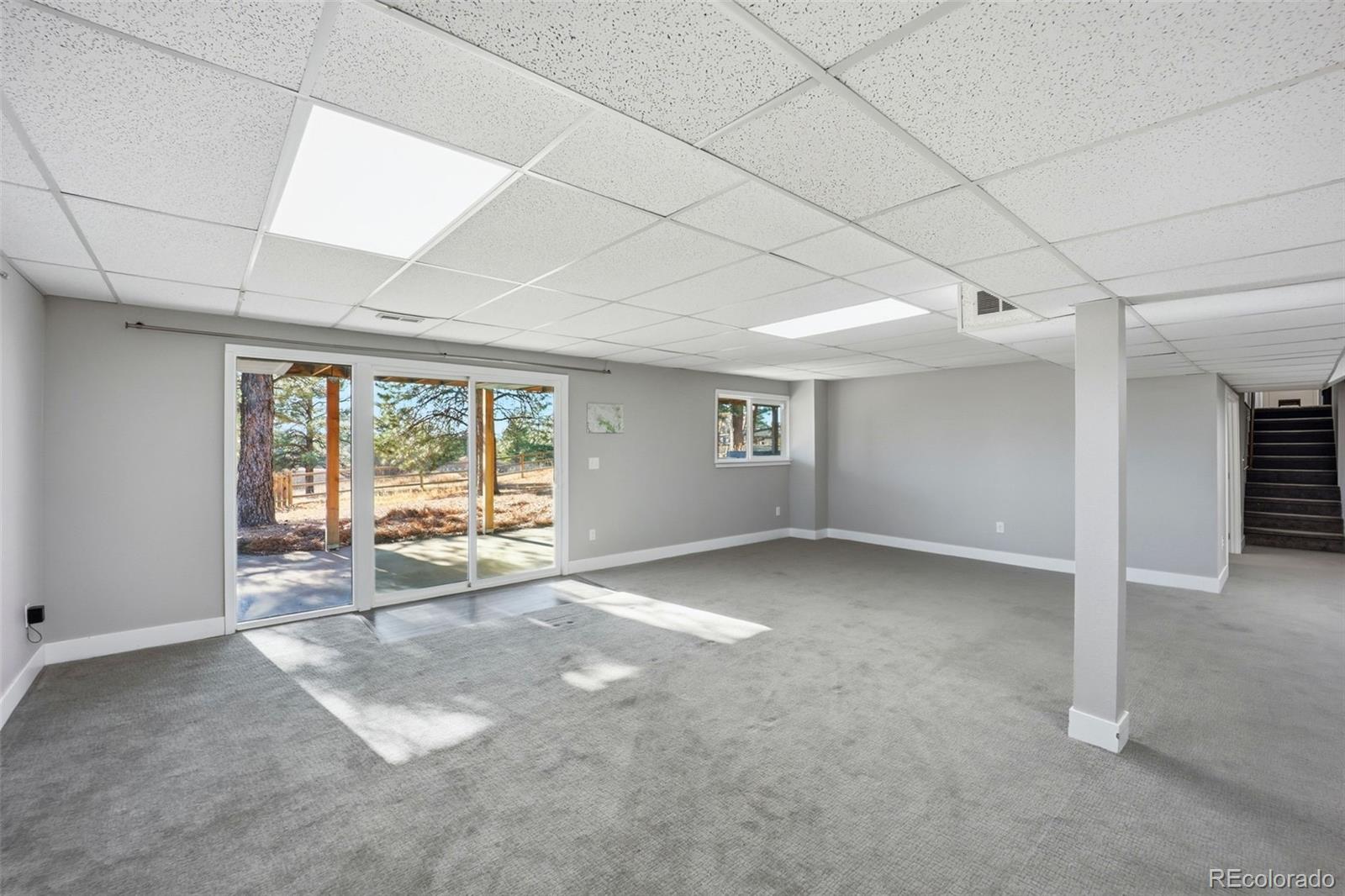 9212 East Tanglewood Road Franktown, CO 80116 - Photo 45 of 50 a view of an empty room with a window