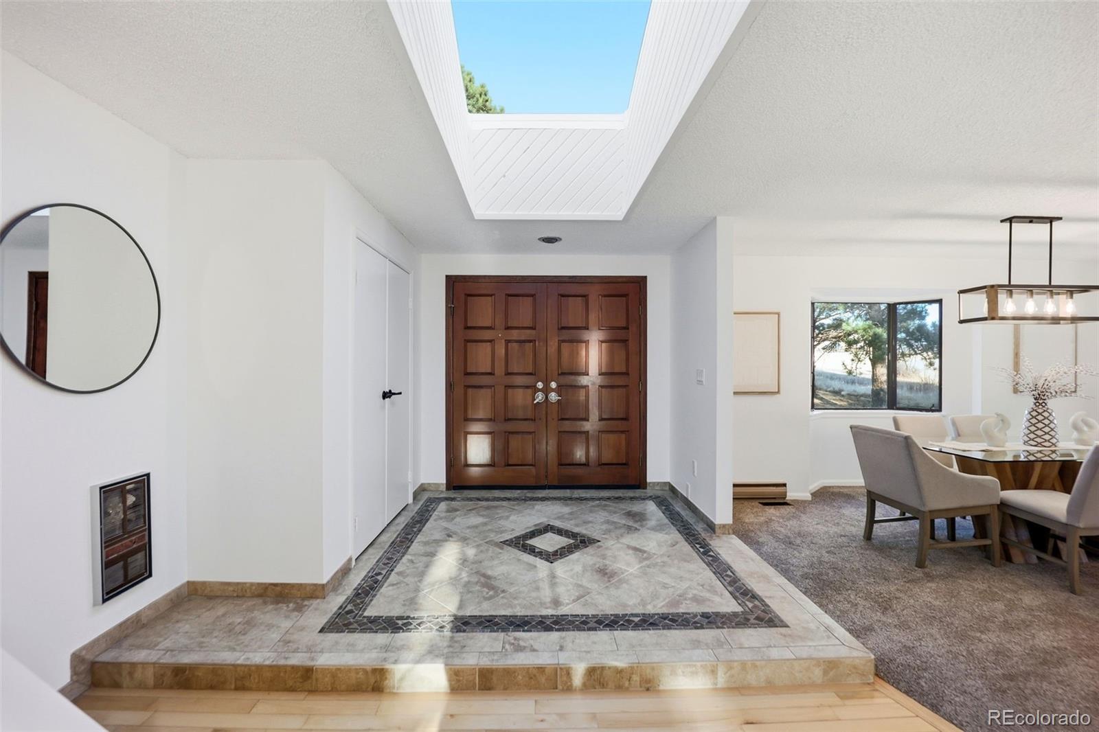 9212 East Tanglewood Road Franktown, CO 80116 - Photo 5 of 50 a view of a livingroom with furniture and window