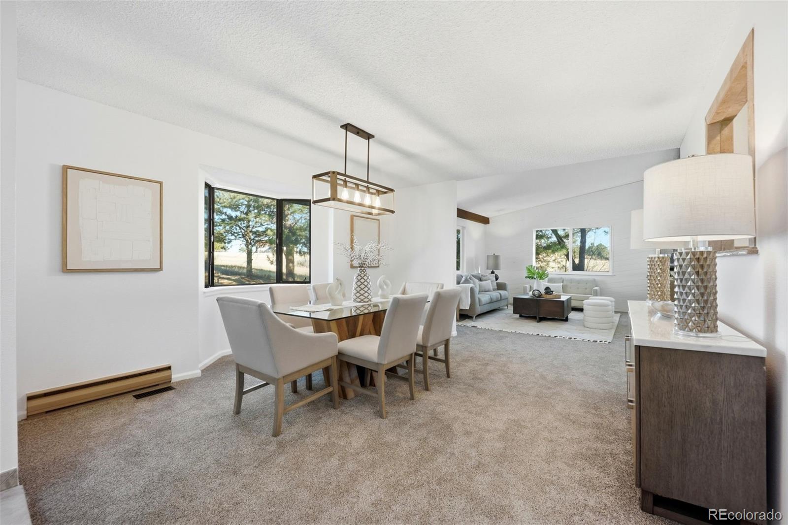9212 East Tanglewood Road Franktown, CO 80116 - Photo 6 of 50 a view of a dining room with furniture and a window