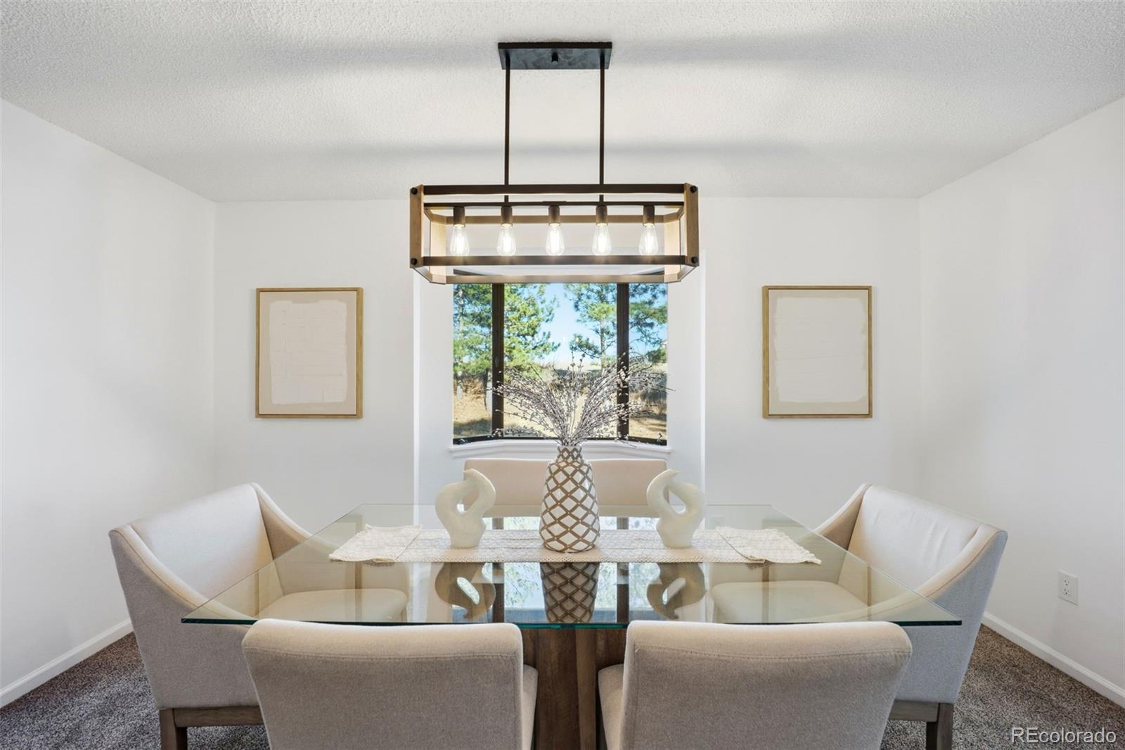 9212 East Tanglewood Road Franktown, CO 80116 - Photo 7 of 50 a dining room with furniture a chandelier and window