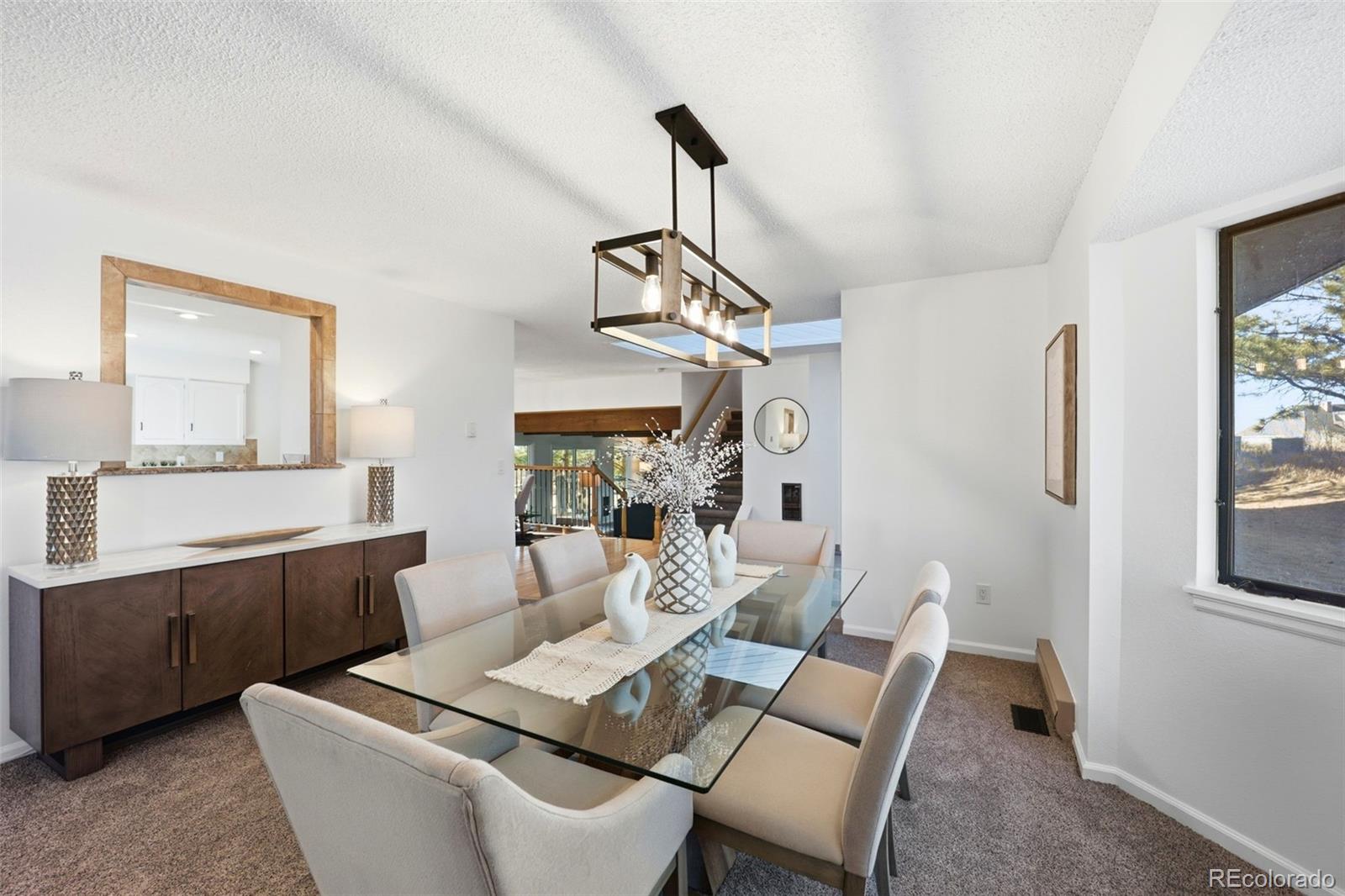 9212 East Tanglewood Road Franktown, CO 80116 - Photo 8 of 50 a view of a dining room with furniture window and outside view