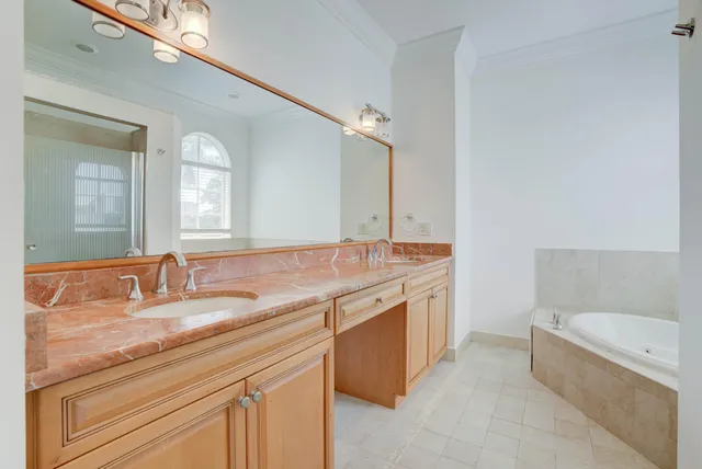 an empty room with a window and bathroom