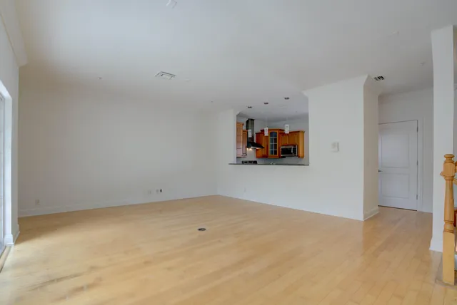 a kitchen with granite countertop a refrigerator and a sink