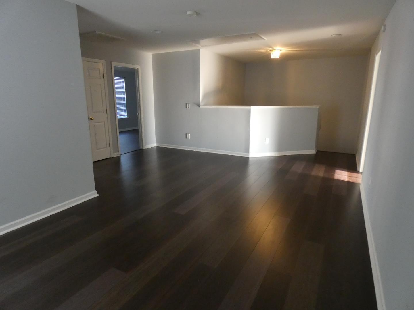 1624 Brown Owl Drive Raleigh, NC 27610 - Photo 10 of 22 a view of a livingroom with wooden floor and a window
