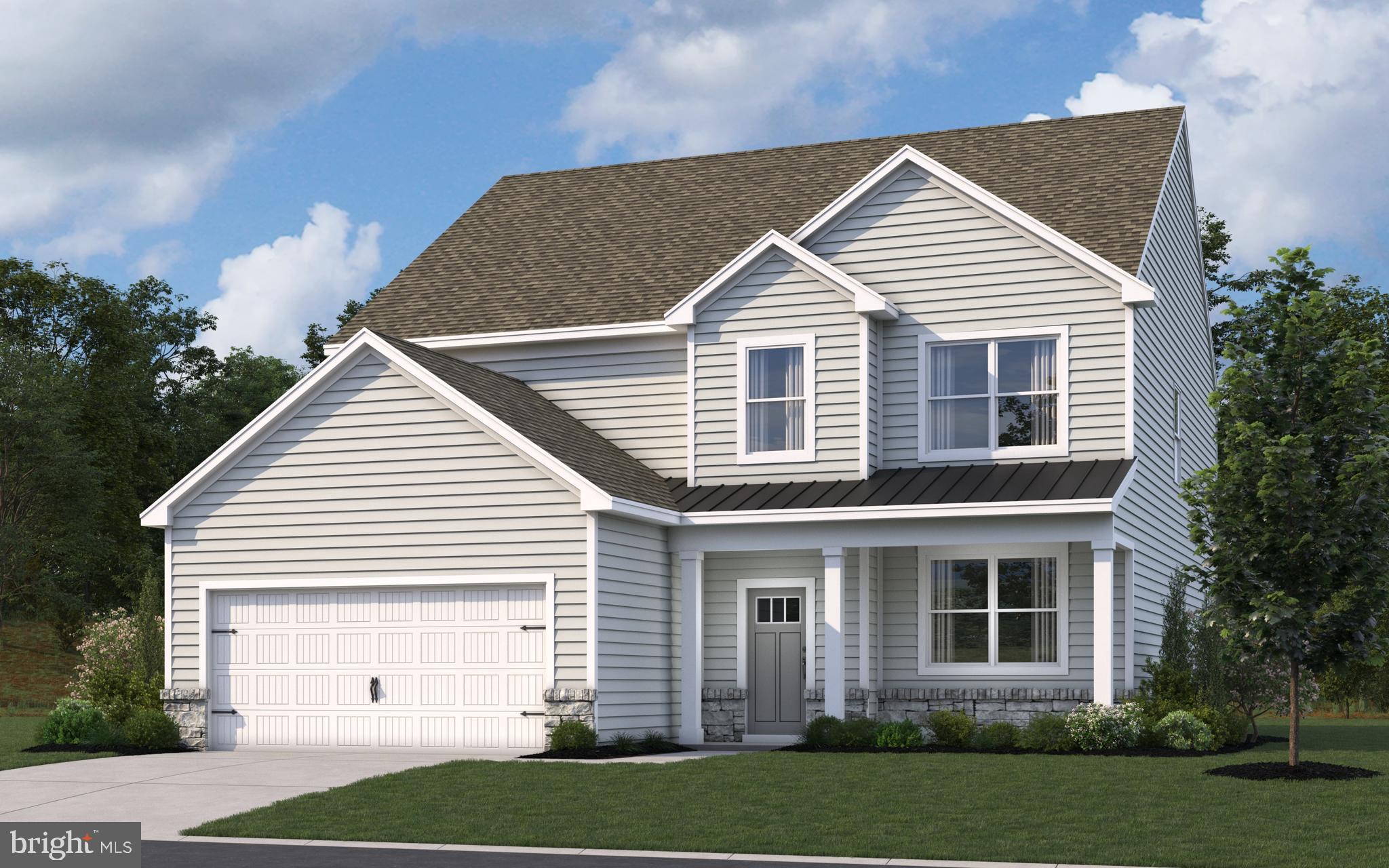 a view of a white house next to a yard and large trees