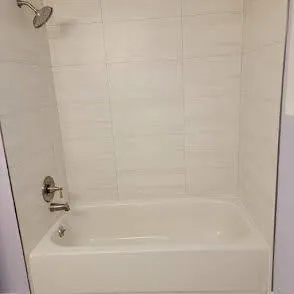 a close up of a bathtub in a bathroom