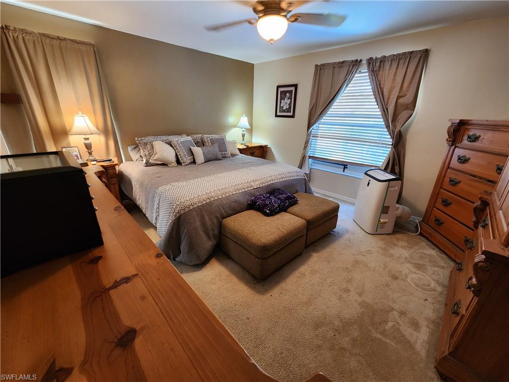 21524 Windham Run Estero, FL 33928 - Photo 11 of 18 a bedroom with a bed and window