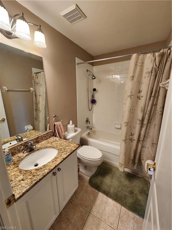 21524 Windham Run Estero, FL 33928 - Photo 13 of 18 a bathroom with a granite countertop sink toilet and shower