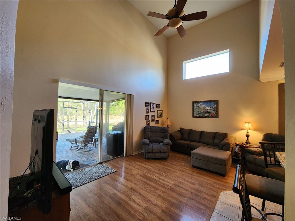 21524 Windham Run Estero, FL 33928 - Photo 16 of 18 a living room with furniture and a flat screen tv