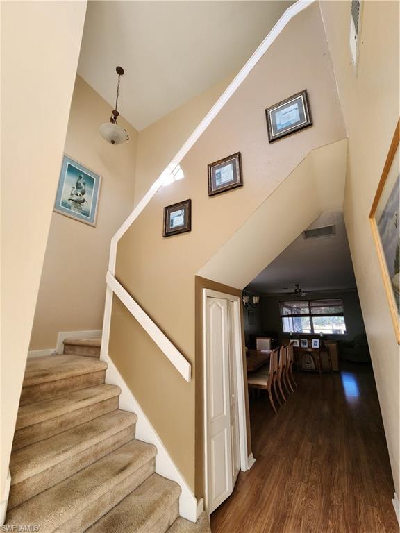 21524 Windham Run Estero, FL 33928 - Photo 7 of 18 a view of entryway and hall with wooden floor