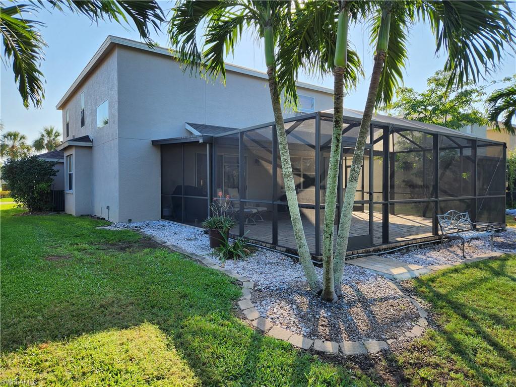 21524 Windham Run Estero, FL 33928 - Photo 9 of 18 a view of a backyard with a tree