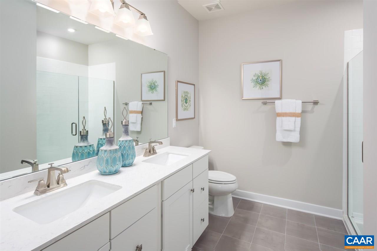 363 Winding Road Keswick, VA 22947 - Photo 16 of 24 a bathroom with a toilet sink and mirror