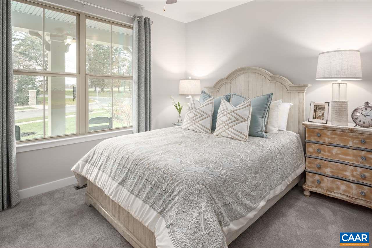 363 Winding Road Keswick, VA 22947 - Photo 18 of 24 a bedroom with a bed and a night stand