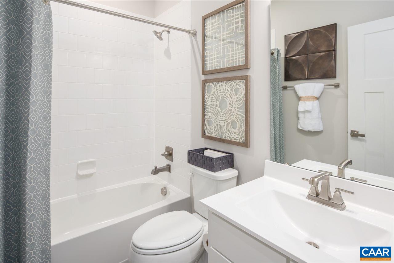 363 Winding Road Keswick, VA 22947 - Photo 19 of 24 a bathroom with a sink toilet and shower