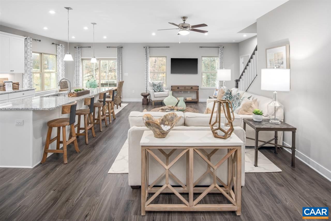 363 Winding Road Keswick, VA 22947 - Photo 2 of 24 a view of a dining room with furniture wooden floor and chandelier